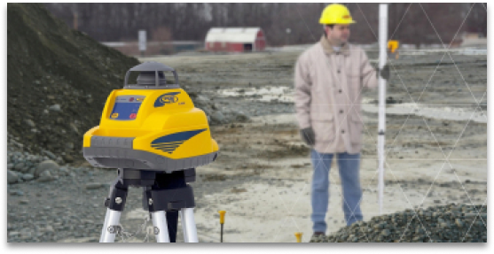 man standing next to laser receiver